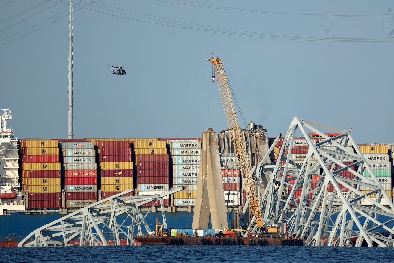 A crane works on the debris of the Francis Scott Key Bridge on March 29, in Baltimore, Maryland.