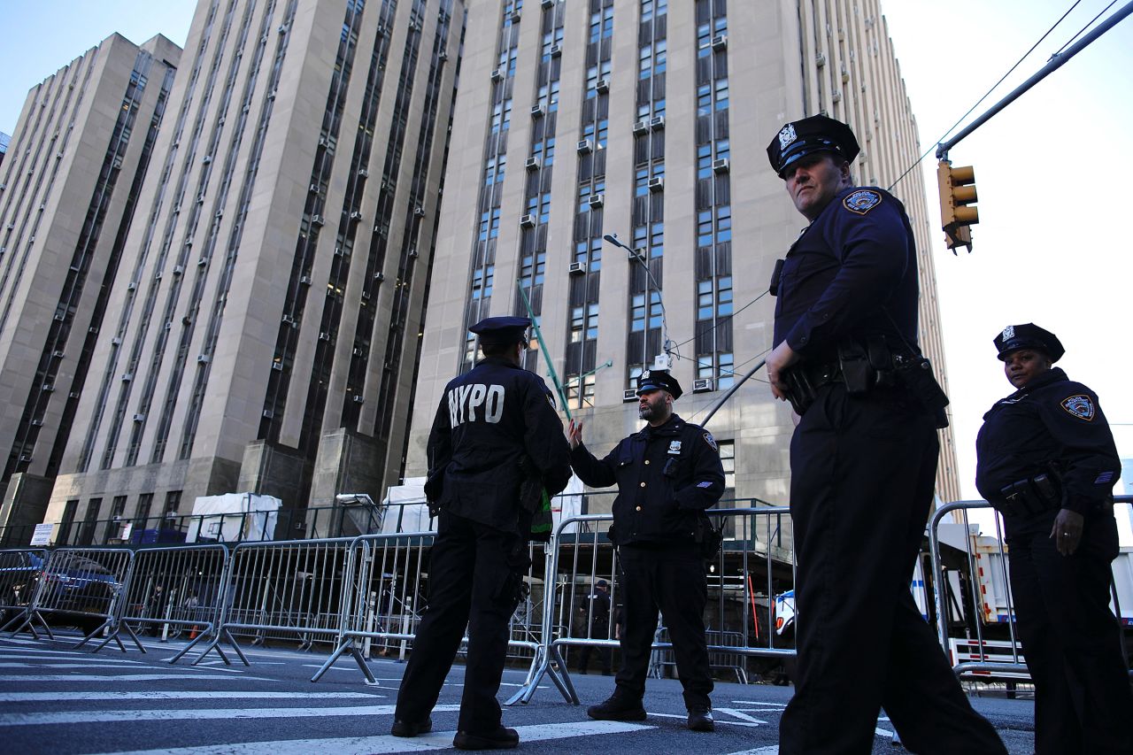 New York police officers patrol outside Manhattan Criminal Court during the second day of the trial of former US President Donald Trump for allegedly covering up hush money payments linked to extramarital affairs in New York City on April 16.