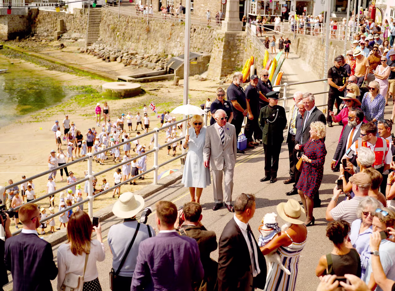 Prince Charles and Camilla, Duchess of Cornwall visit a fishing village in Cornwall, England, on July 18.