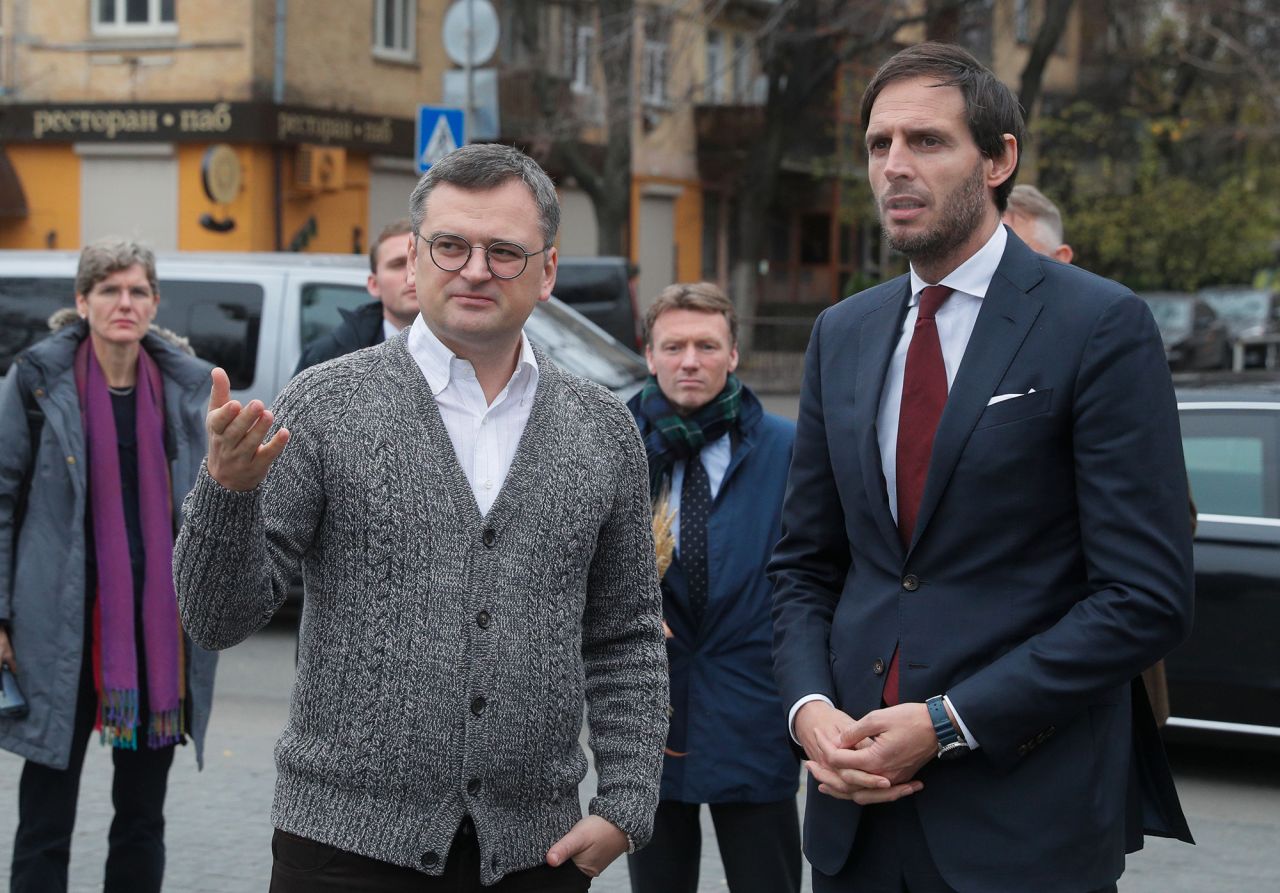 Ukraine's Foreign Minister Dmytro Kuleba, left, and his Dutch counterpart Wopke Hoekstra visit the Holodomor Monument at the National Museum of the Holodomor-Genocide, in Kyiv, Ukraine, on November 15.