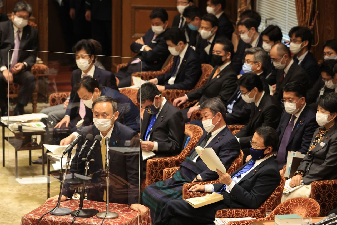 Japanese Prime Minister Yoshihide Suga answers a question at the Lower House's budget committee session in Tokyo on January 26.