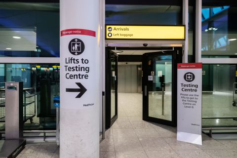 Signage leading to one of the testing centers at Heathrow Airport is seen on December 22, 2020 in London. 