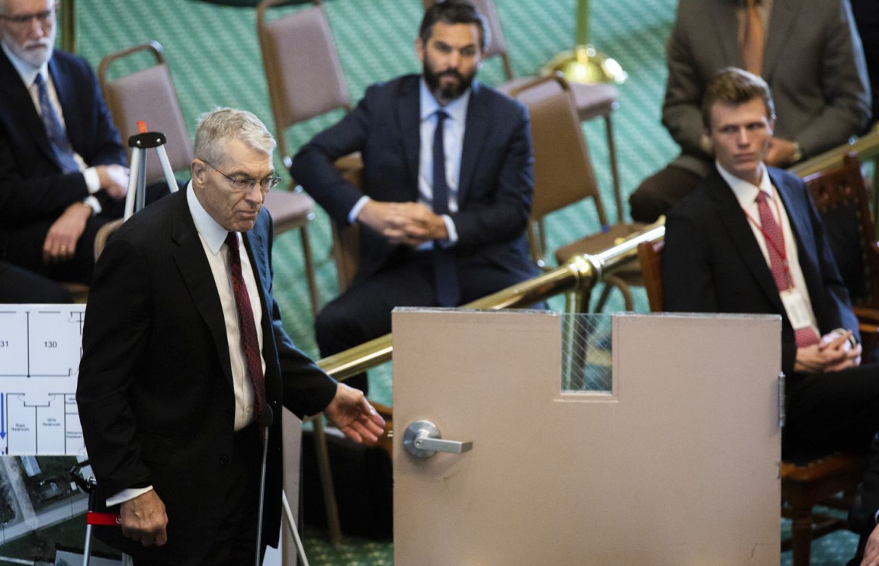 Col. Steven McCraw shows how an interior door in Robb Elementary School failed to lock securely during the hearing at the Texas State Capitol in Austin, on June 21. 