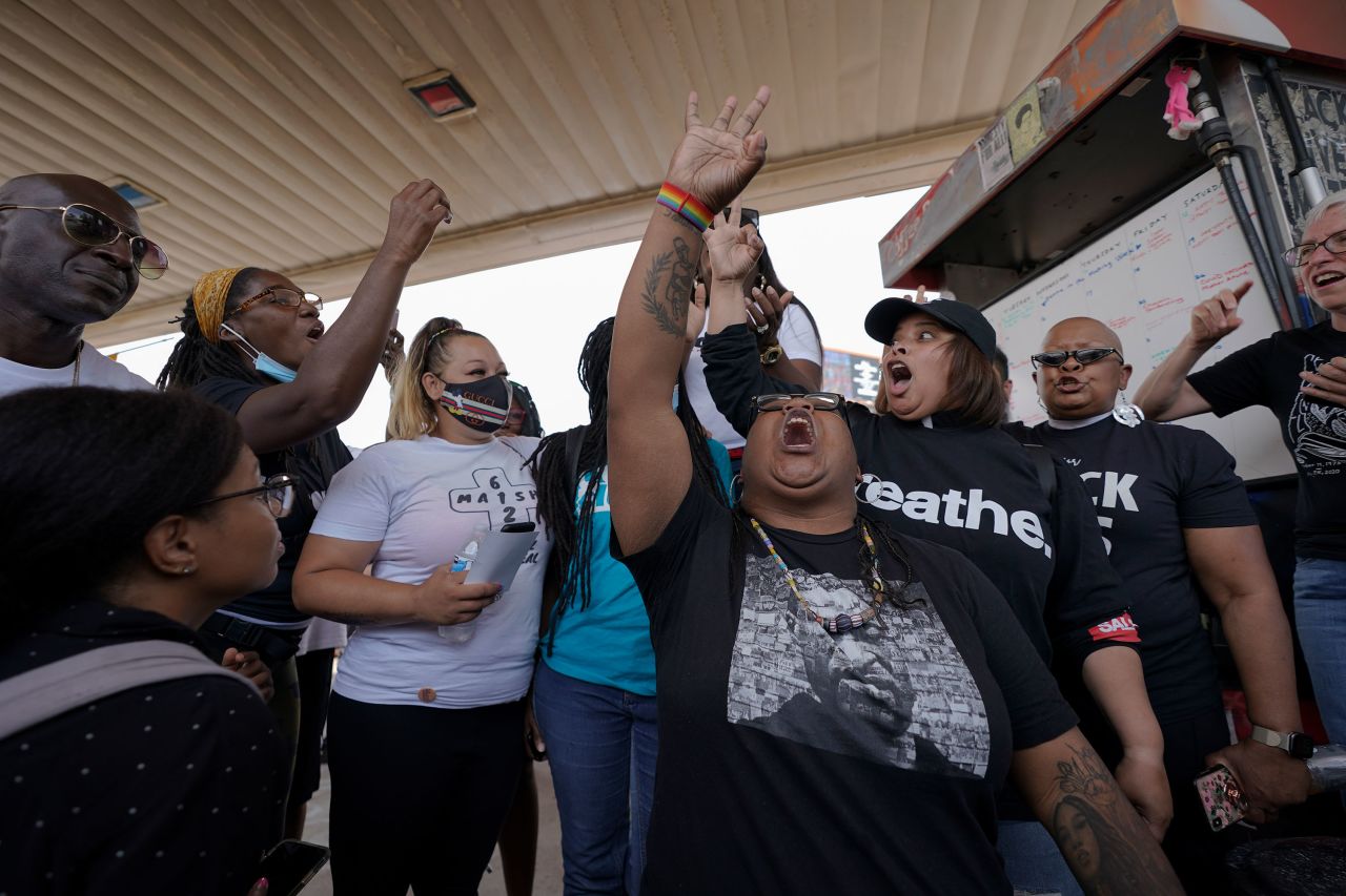 Jennifer Starr Dodd, center, holds up three fingers to symbolize the three other police officers still to be tried, as supporters react to the sentencing of former Minneapolis police Officer Derek Chauvin for the murder of George Floyd on Friday, June 25, at George Floyd Square in Minneapolis.