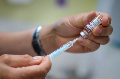 Vaccinators administer the Oxford AstraZeneca Covid-19 vaccine at a medical center in Bridport, England, on March 20. 