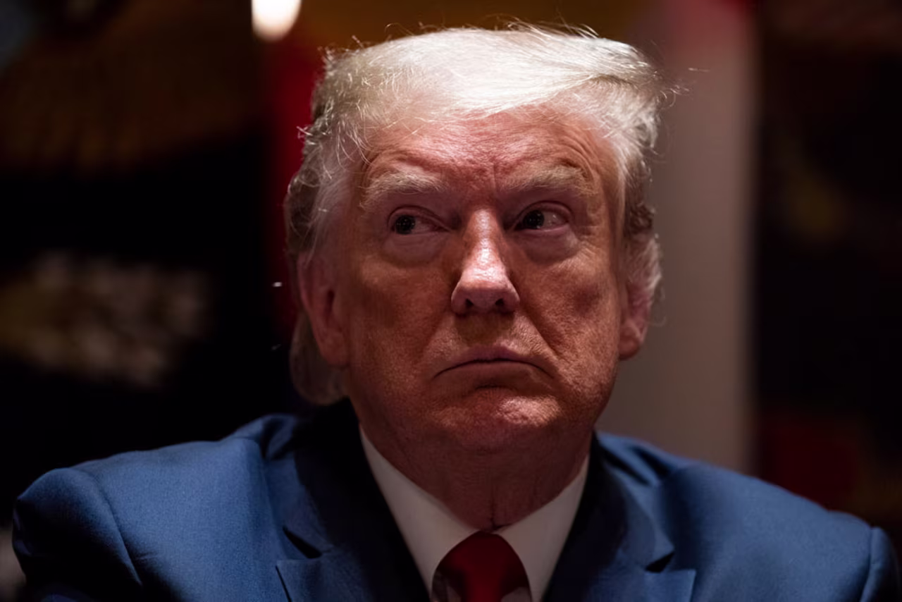 US President Donald Trump listens during a meeting with North Dakota Gov. Doug Burgum, and Colorado Gov. Jared Polis at the White House on Wednesday, May 13, in Washington.