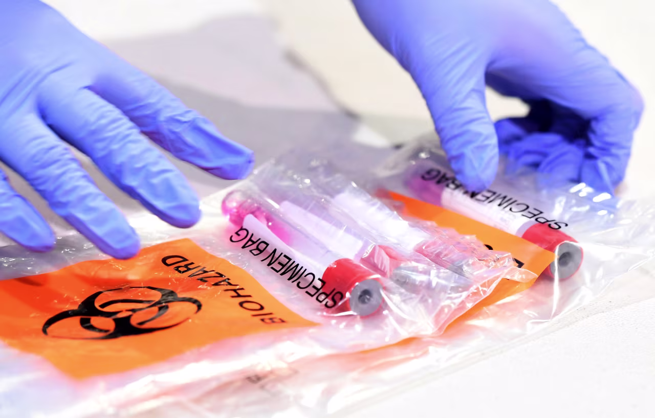 A health worker collects coronavirus tests samples at a testing site on August 3 in Las Vegas, Nevada. 