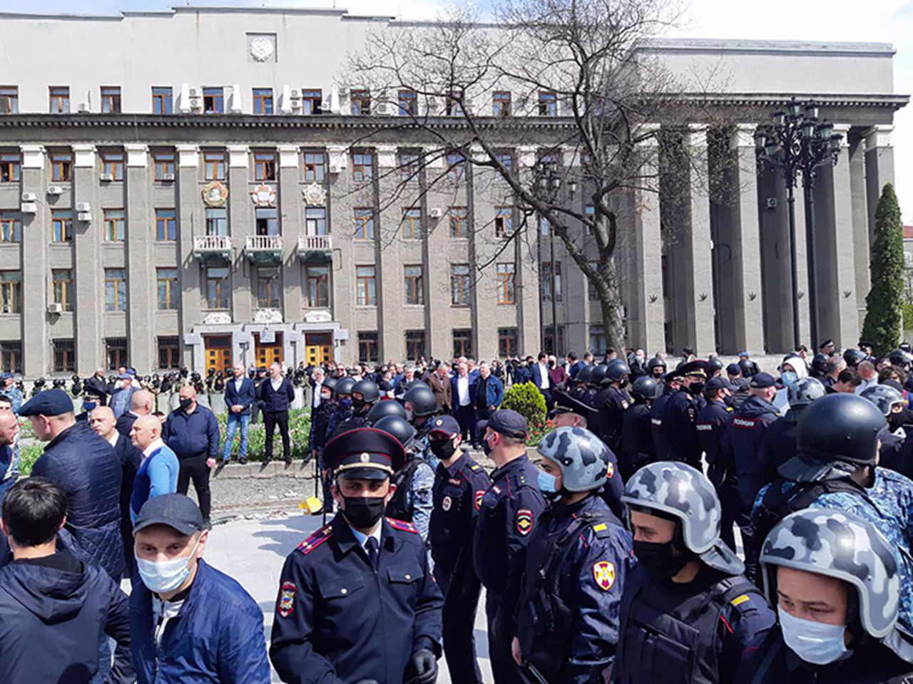  Law enforcement officers and people taking part in a protest against the self-isolation order in Svobody Square in Vladikavkaz, Russia on Monday, April 20. 