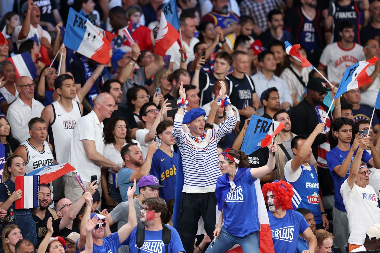 French fans cheer during the game. 