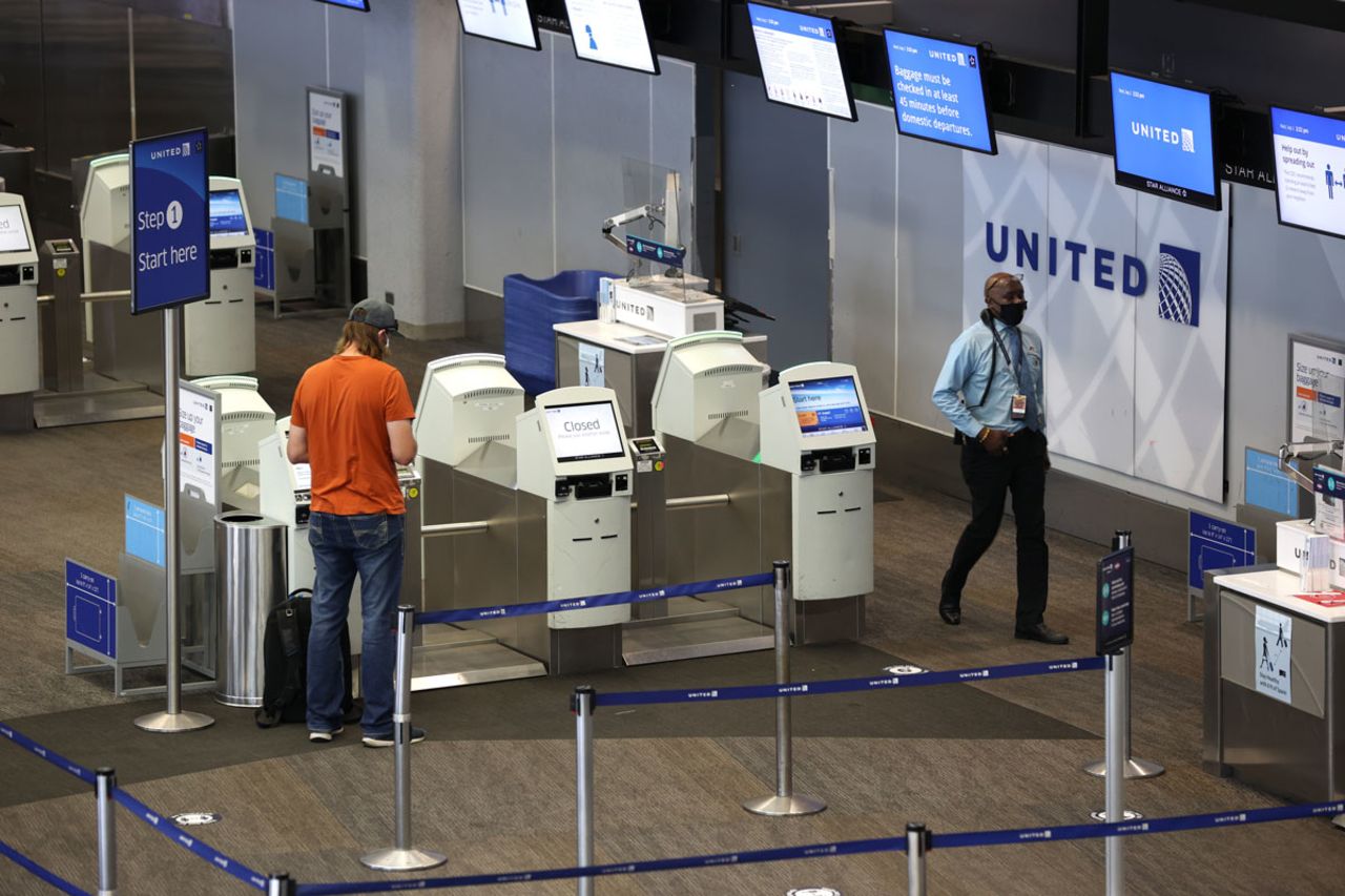 A United Airlines passenger checks in for a flight at San Francisco International Airport on September 02.