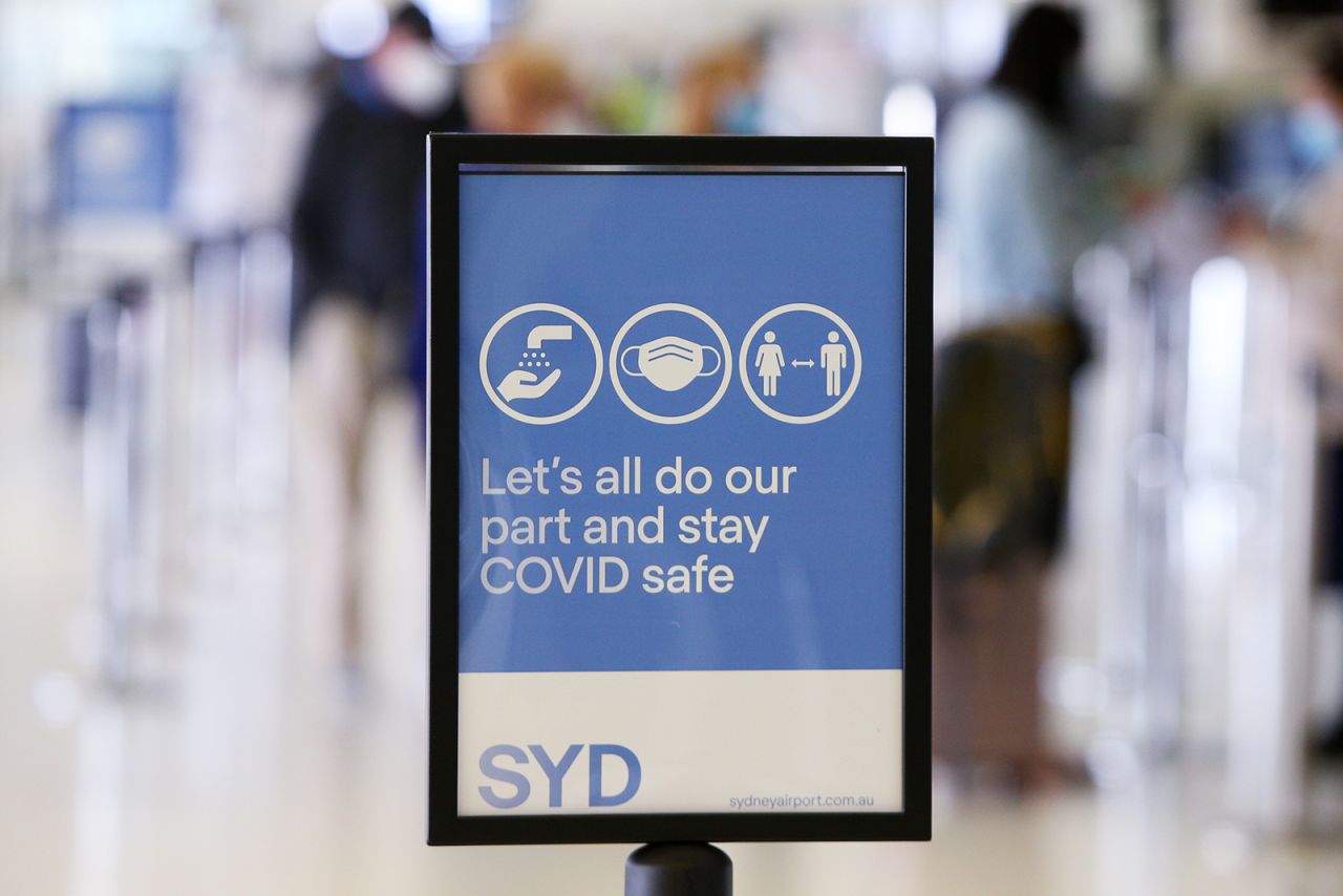 ?A Covid-19 safety sign is seen at Sydney's International Airport on November 1, in Sydney, Australia.