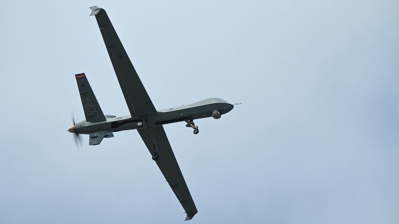 In this February 21 photo, a US Air Force 119th Wing MQ-9 Reaper flys over an airfield at Andersen Air Force Base, Guam.