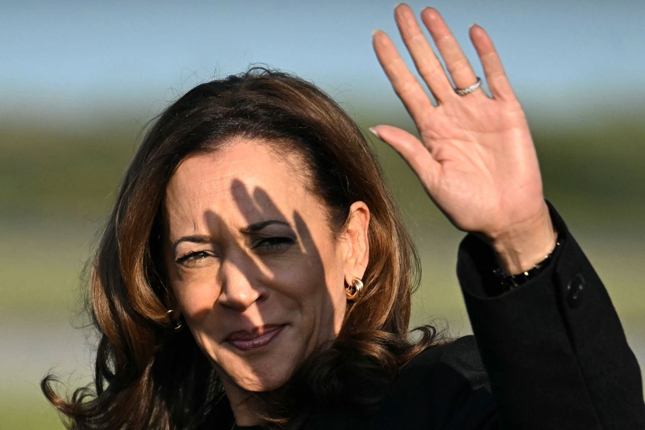 Vice President and Democratic presidential candidate Kamala Harris waves as she arrives at Philadelphia International Airport in Philadelphia on September 9.