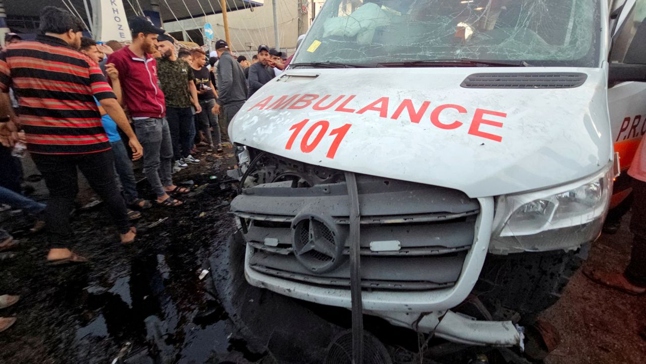 Palestinians inspect a damaged ambulance after an attack outside Al-Shifa hospital in Gaza City on November 3. 