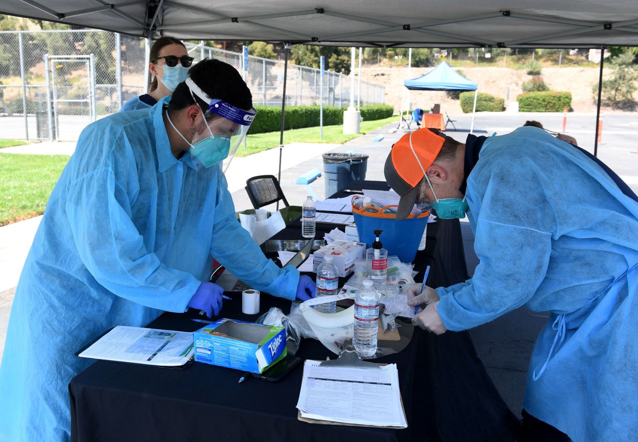 Mend Urgent Care workers perform drive-up Covid-19 testing at Woodbury University on August 24 in Burbank, California. 