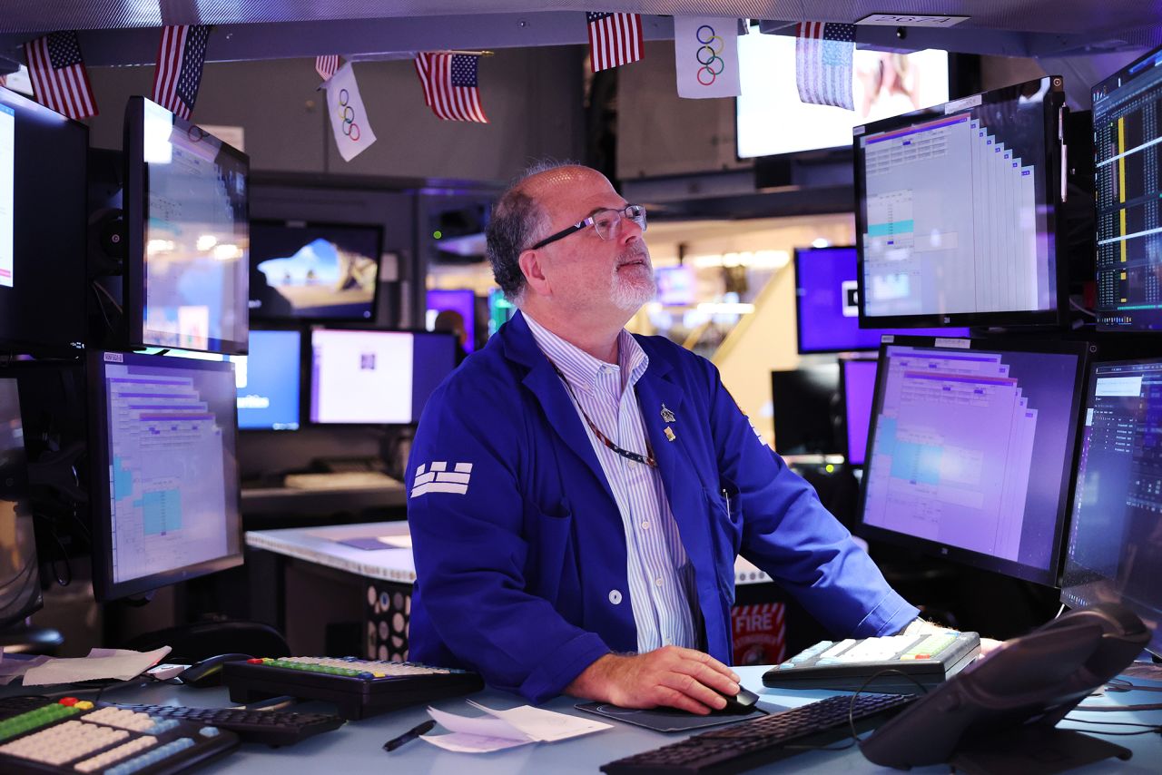 Traders work on the floor of the New York Stock Exchange today.