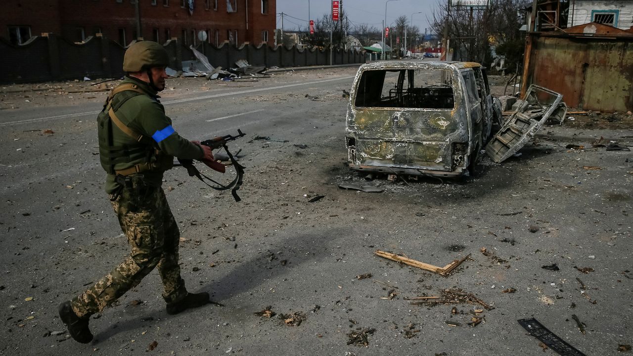 A Ukrainian service member walks on the front line near Kyiv, Ukraine on March 29.