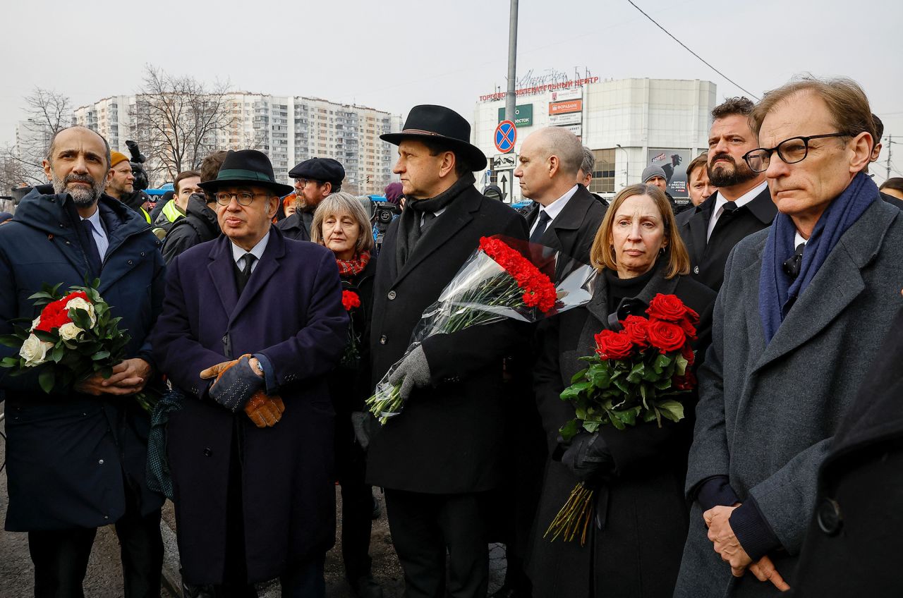 Foreign diplomats, including French Ambassador to Russia Pierre Levy and US Ambassador to Russia Lynne Tracy, (third right,) wait near the 'Quench My Sorrows' church before a funeral service for Alexey Navalny in Moscow, Russia, on March 1.