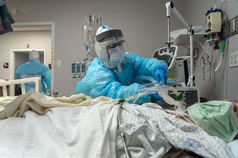 A medical staff member sets up a ventilator for a patient in the Covid-19 intensive care unit at the United Memorial Medical Center on December 29 in Houston, Texas. 