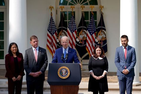 President Joe Biden, center, joined by Secretary of Labor Marty Walsh, second from left, Director of the National Economic Council Brian Deese, far right, and negotiators of the railway labor agreement, speaks in the Rose Garden of the White House in Washington, DC, on September 15.