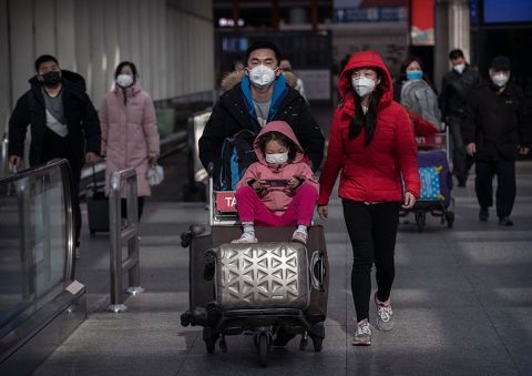 Passengers wear protective masks at Beijing Capital Airport on Thursday, January 30.