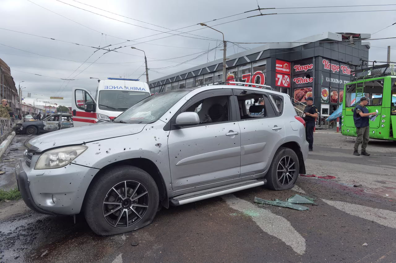 Investigators work at the site of a Russian military strike in Kharkiv, Ukraine on July 21.