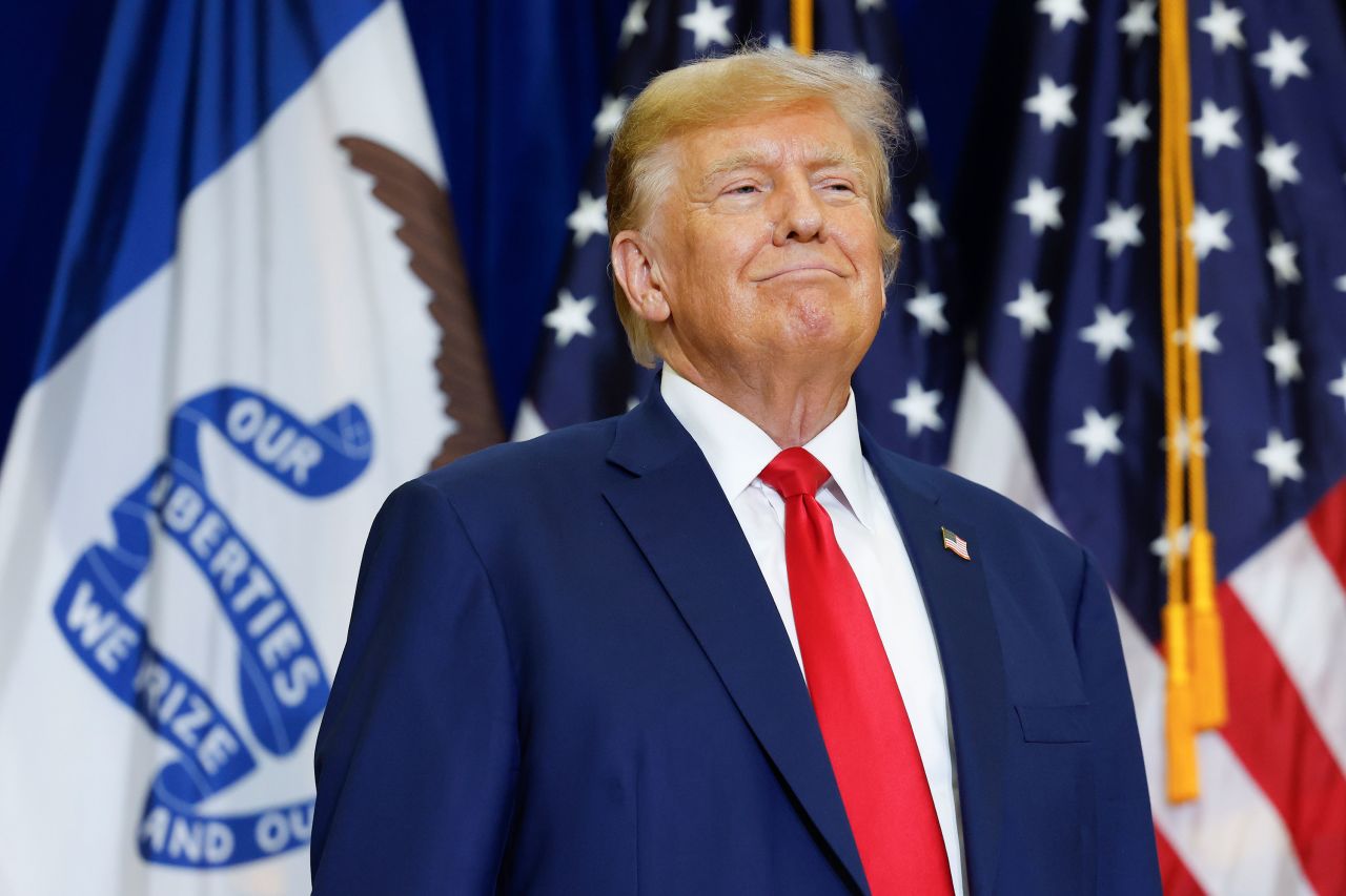 Former President Donald Trump looks on during a campaign rally in Mason City, Iowa, on January 5.