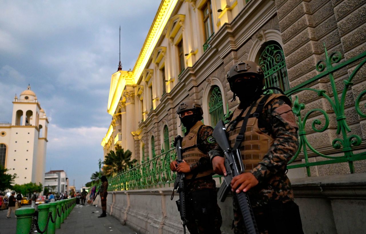 Security forces, including the police and the army, clear people from the historic centre of San Salvador as part of the government's emergency decree to curb the spread of the new coronavirus, COVID-19, on March 21, 2020. - Nearly one billion people around the world were confined to their homes Saturday as many countries implemented stay-at-home orders, and as deaths from the global coronavirus pandemic surged towards 13,000. (Photo by Marvin RECINOS / AFP) (Photo by MARVIN RECINOS/AFP via Getty Images)