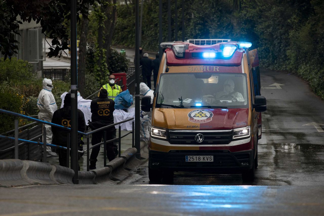 Medical staff move a patient into an ambulance at La Paz Hospital on March 16, in Madrid, Spain.