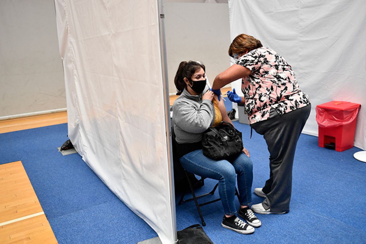 A nurse administers a dose of the Moderna Covid-19 vaccine at a clinic for Catholic school education workers including elementary school teachers and staff at a vaccination site at Loyola Marymount University on March 8,  in Los Angeles, California. 