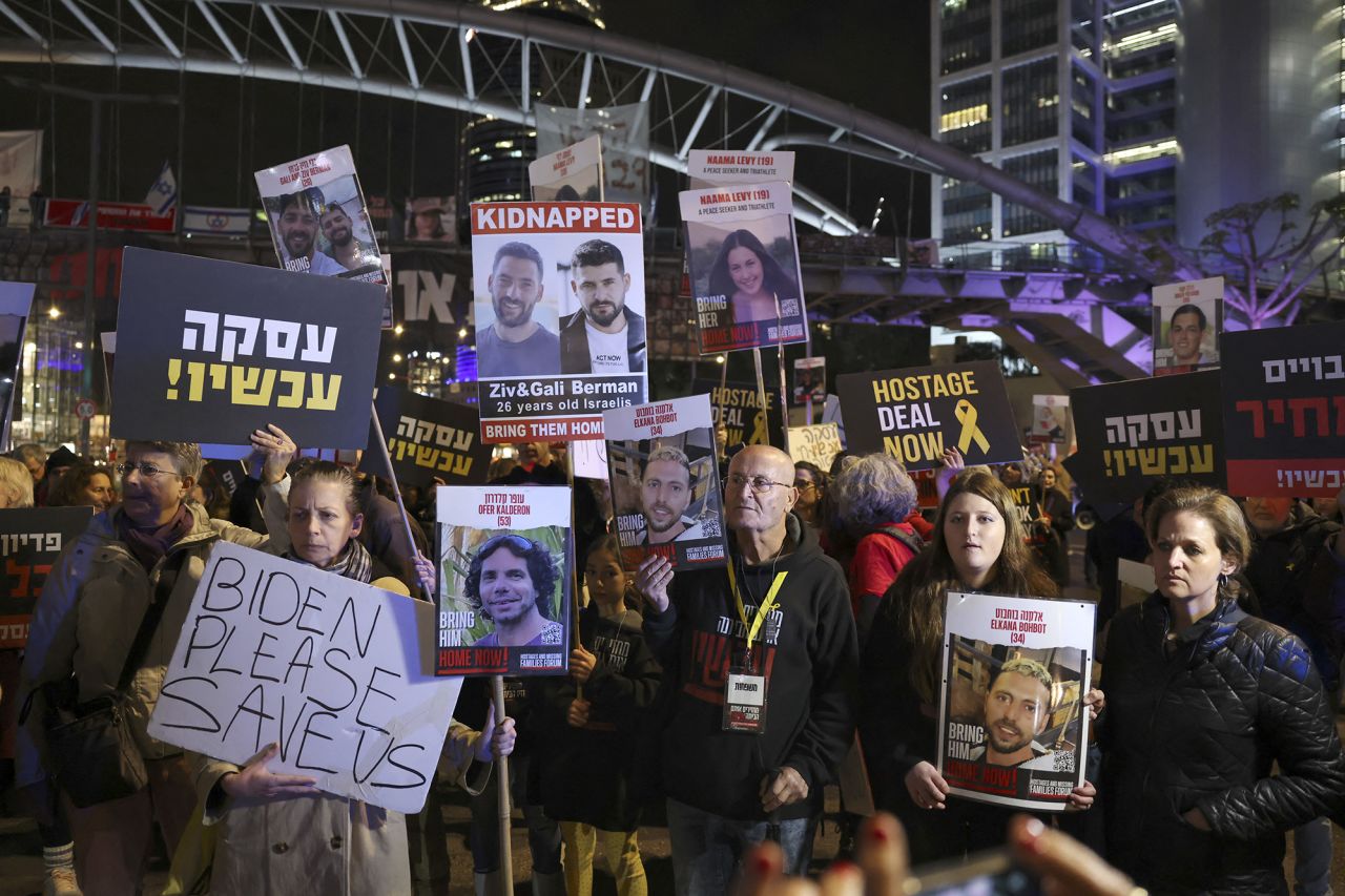 Relatives and supporters hold placards during a rally calling for the release of Israeli hostages held by Hamas in Tel Aviv, Israel, on February 15.