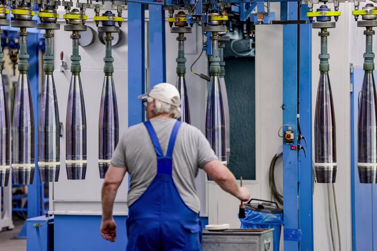 A technician at German armaments company Rheinmetall works on 155mm ammunition that will be delivered to Ukraine at the Rheinmetall factory in Unterluess, Germany, on June 6.