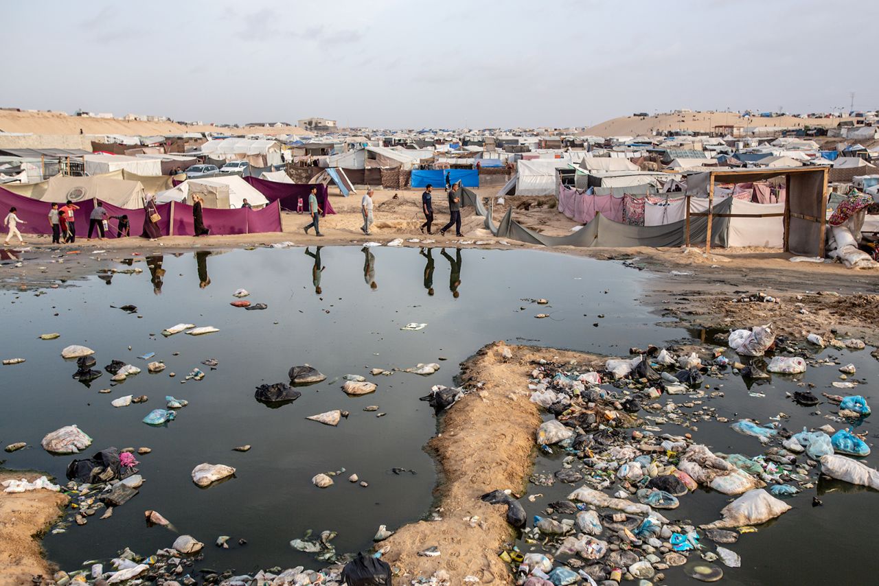 Palestinians who take refuge and live in tents due to ongoing Israeli attacks in Gaza, also face the risk of epidemics due to uncollected garbage and accumulated sewage water in Rafah, Gaza on April 26.