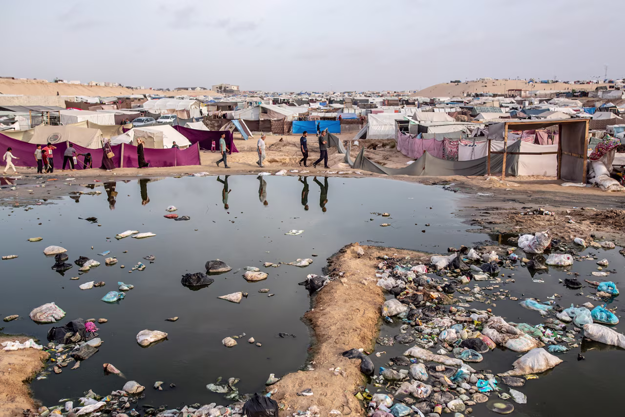 Palestinians who take refuge and live in tents due to ongoing Israeli attacks in Gaza, also face the risk of epidemics due to uncollected garbage and accumulated sewage water in Rafah, Gaza on April 26.
