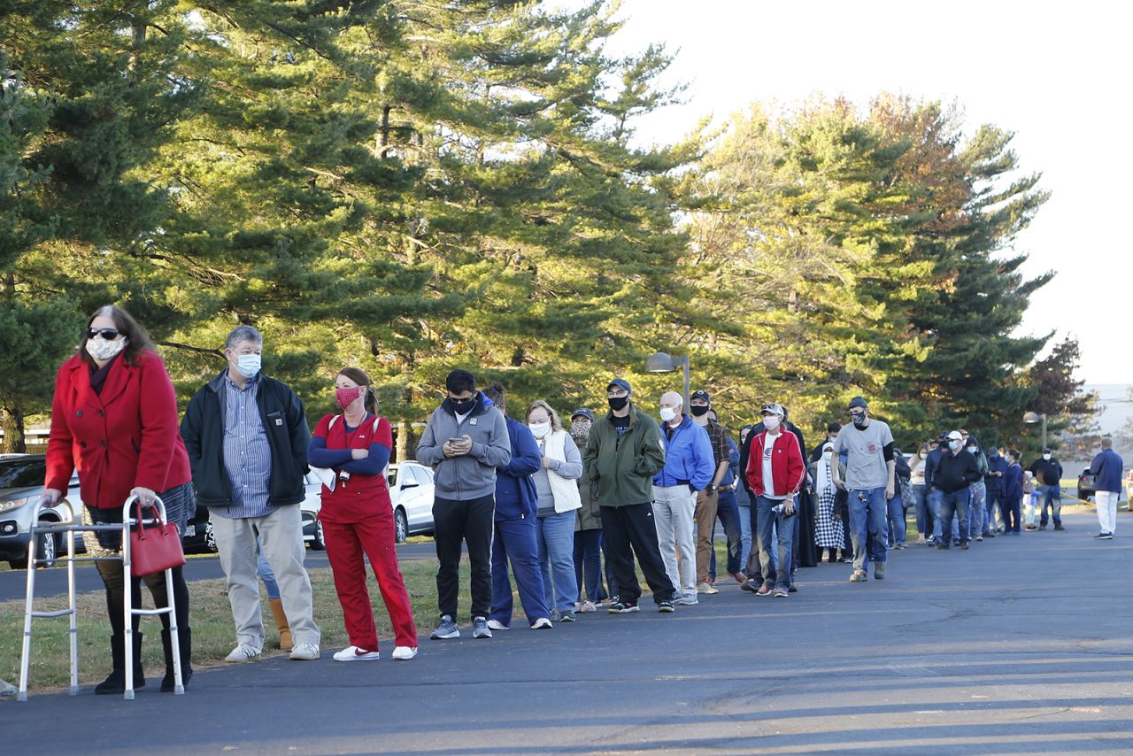 People stand in line to vote outside Maranatha Baptist Church on Tuesday in Columbus, Ohio. 