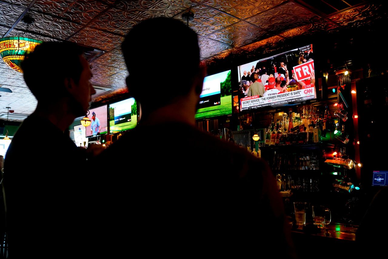 A TV displays news from former President Donald Trump's rally in Butler, Pennsylvania, in Milwaukee, Wisconsin, on Saturday, July 13.