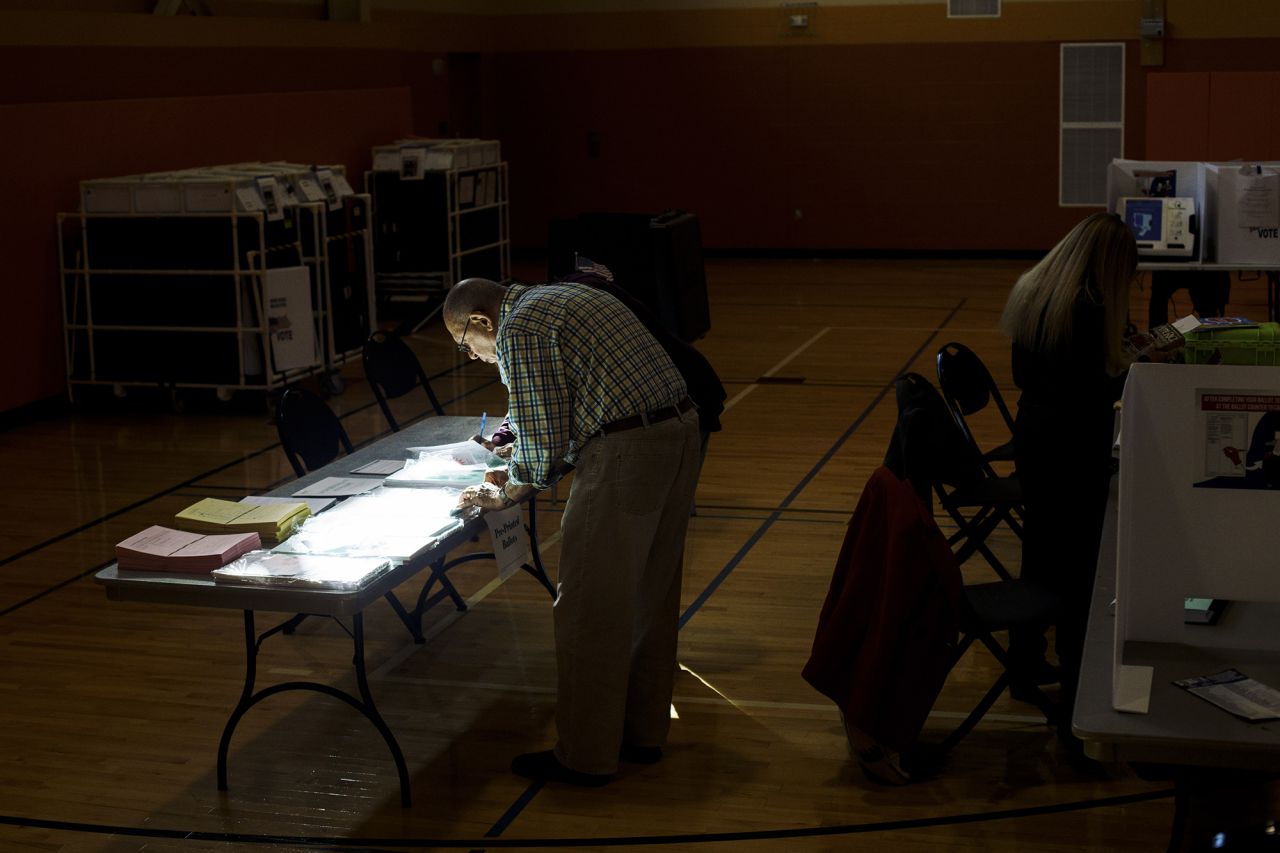 Ron Betz, a poll worker, pulls a provisional ballot for a voter at a polling location in Columbus, Ohio on Tuesday. 