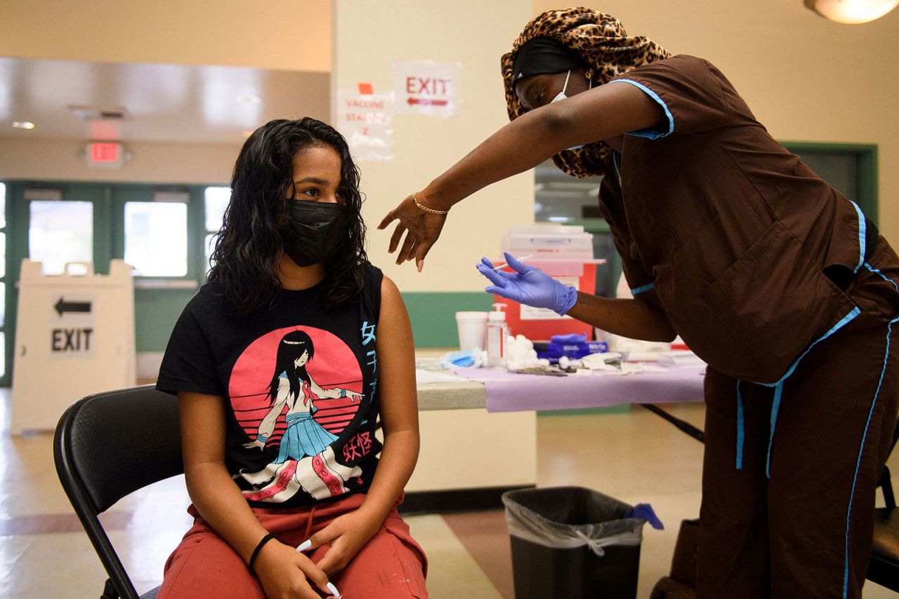 12-year-old Brianna Banuelos receives a dose of the Pfizer/BioNTech Covid-19 vaccine on May 14 in Los Angeles.