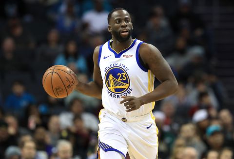 Draymond Green of the Golden State Warriors brings the ball up the court against the Charlotte Hornets during their game at Spectrum Center on December 4, 2019 in Charlotte, North Carolina.