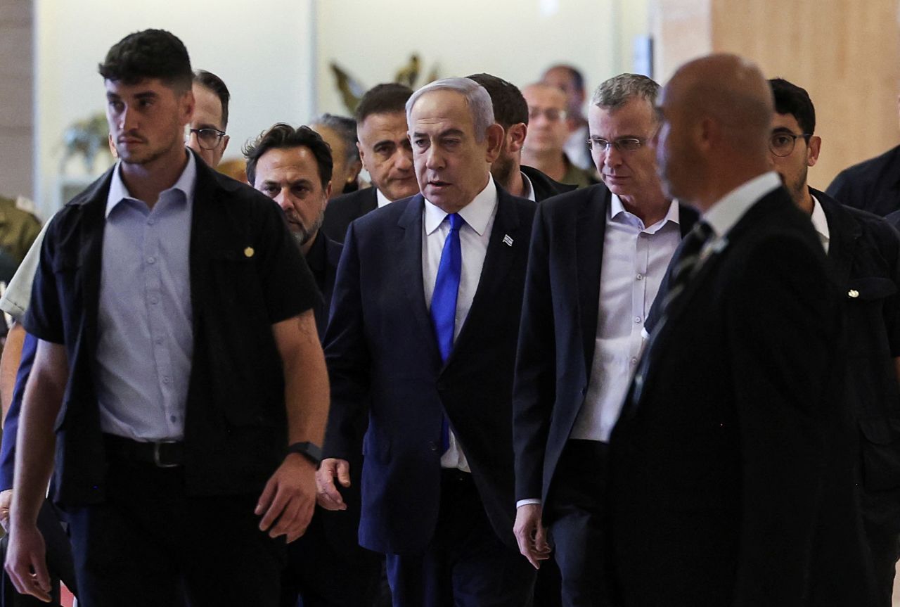 Israeli Prime Minister Benjamin Netanyahu, center, arrives at a Likud party meeting in Jerusalem on Monday.