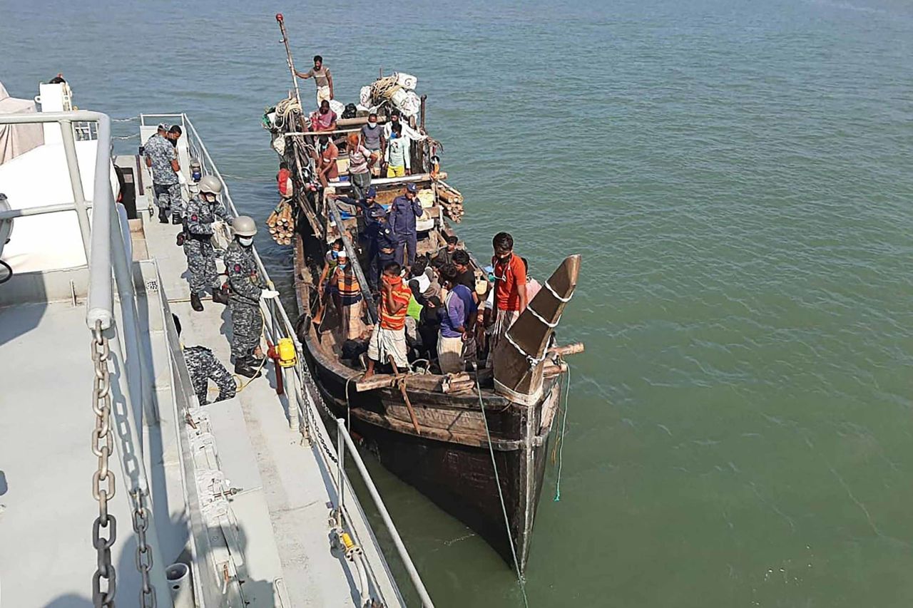 Rohingya refugees are seen on a boat near the coast of Cox's Bazar, Bangladesh, on May 2, after being stranded at sea during an attempt to reach Malaysia.