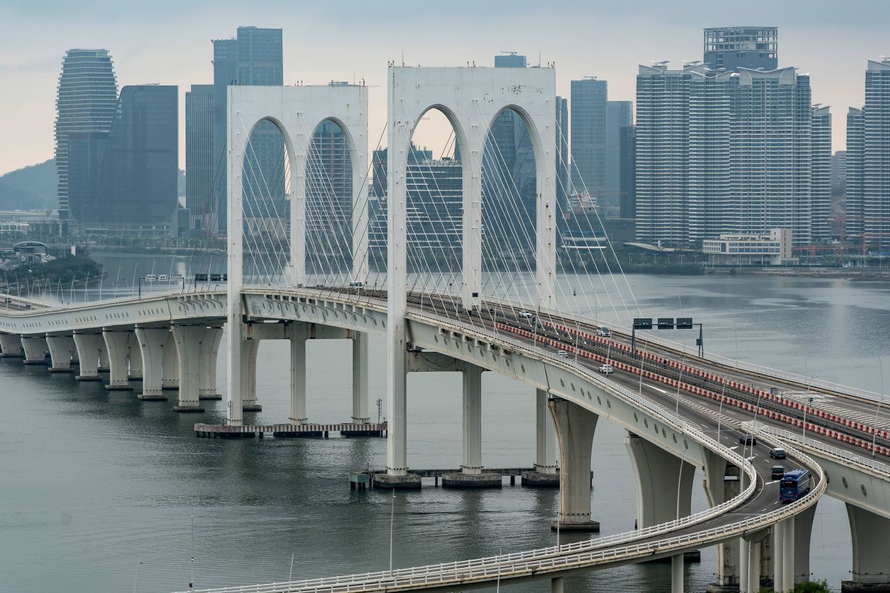 Vehicles drive across a bridge on February 5 in Macao, China.