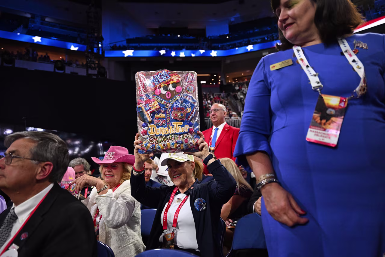 Betty “Ginger Betty” Venetian holds up a Donald Trump-themed cookie. 