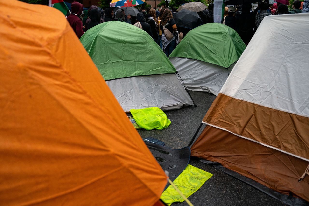 Tents are setup on H street as activists and students protest near an encampment at George Washington University in Washington, DC, on April 27.