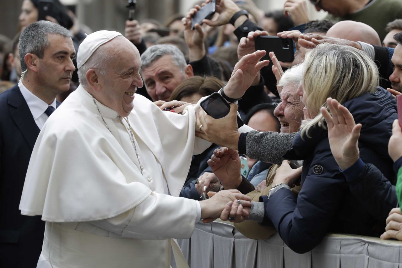 Pope Francis greets people in St. Peter's Square at the Vatican on Wednesday.