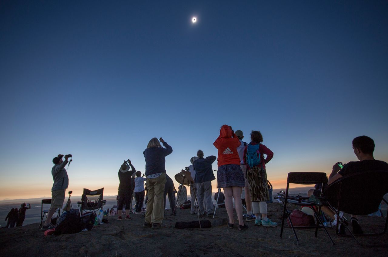 Locals and travelers from around the world gather on Menan Butte to watch the total solar eclipse, in Menan, Idaho, on August 21, 2017.