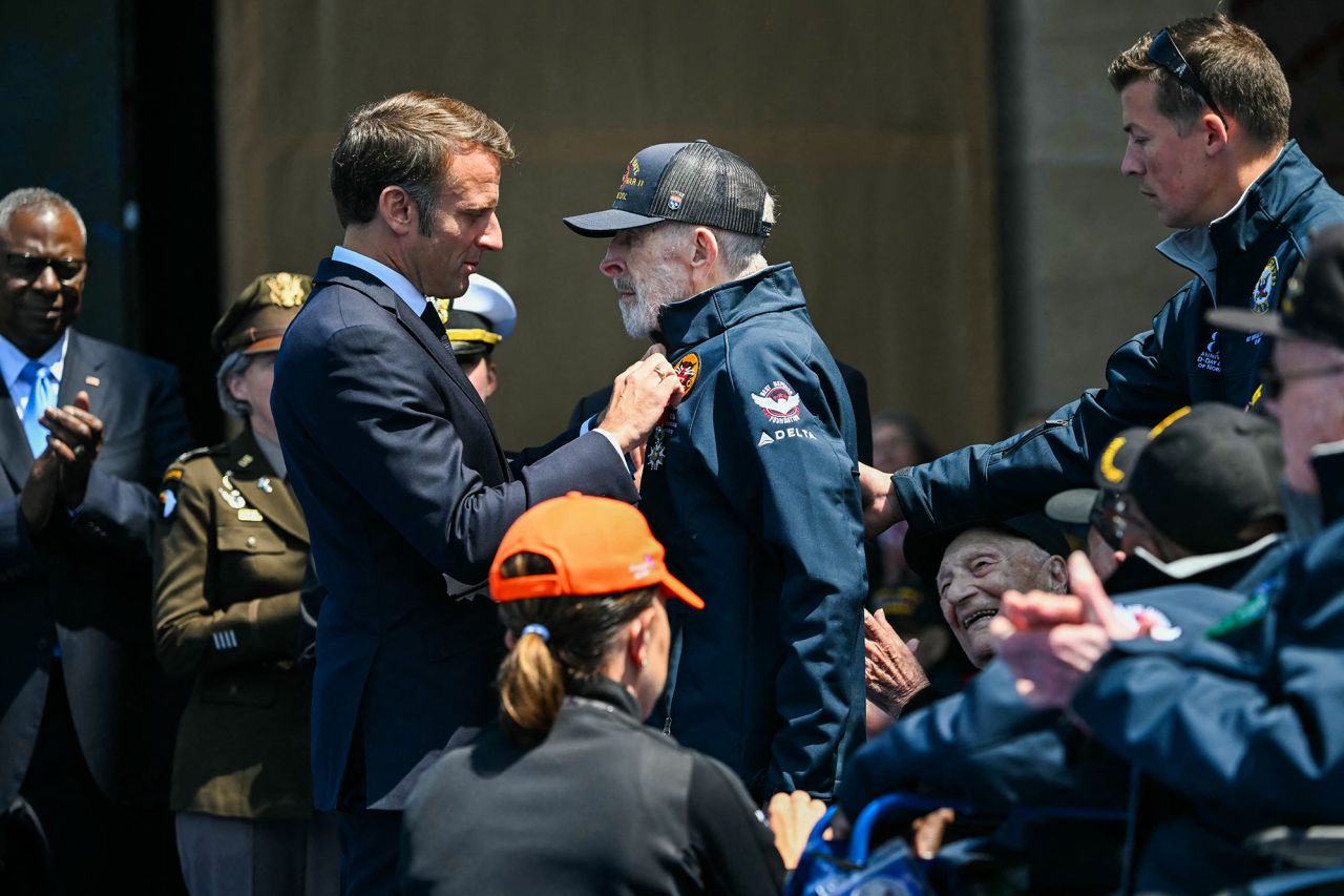 France's President Emmanuel Macron, left, awards US WWII veteran William Casassa with the insignia of Knight in the Legion of Honour order (Chevalier de la Legion d'Honneur) during the US ceremony marking the 80th anniversary of the World War II D-Day Allied landings, on June 6.