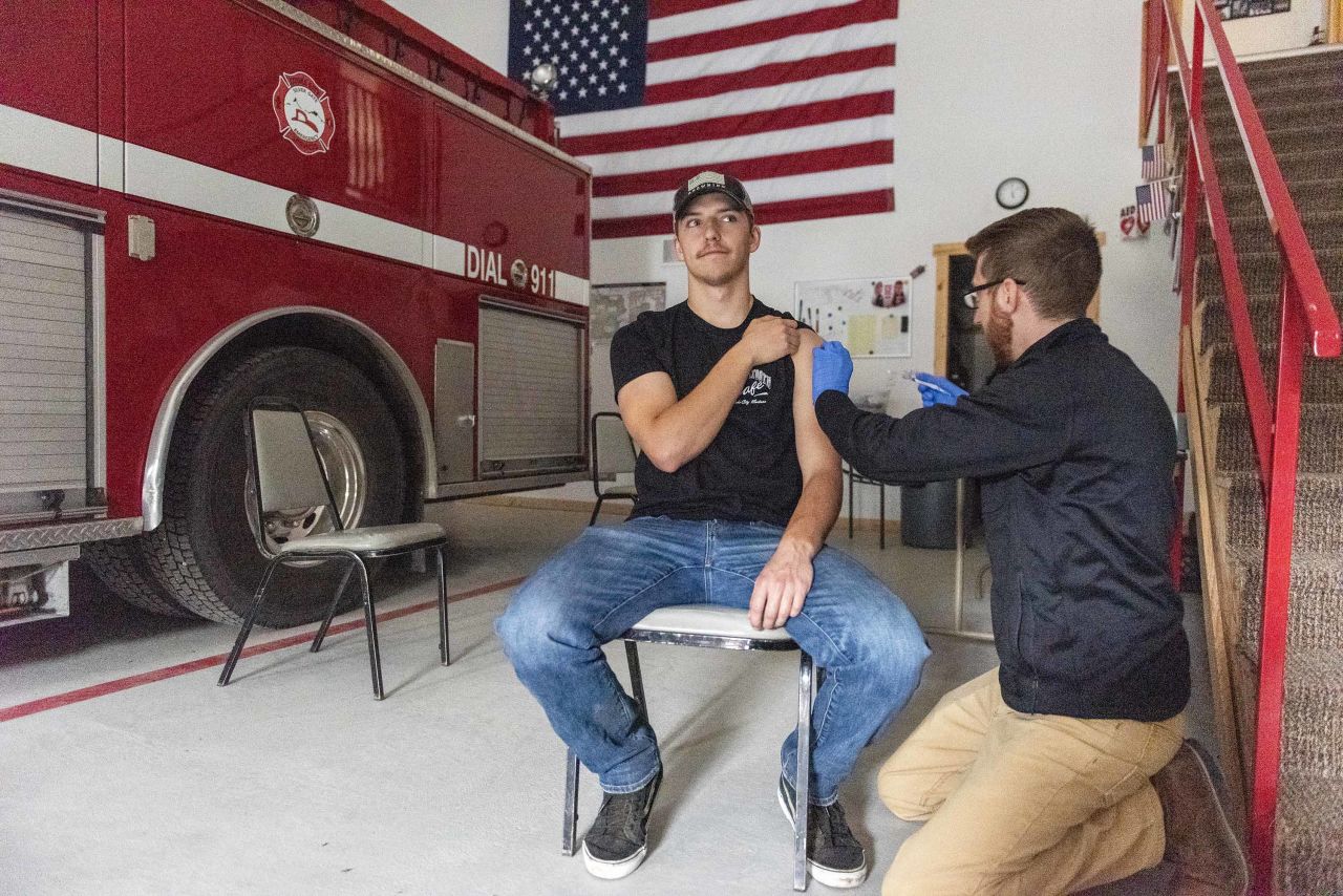 Zack Cather is vaccinated with the Johnson & Johnson vaccine at a clinic set up at a firehouse in Cooke City, Montana, on June 8. 