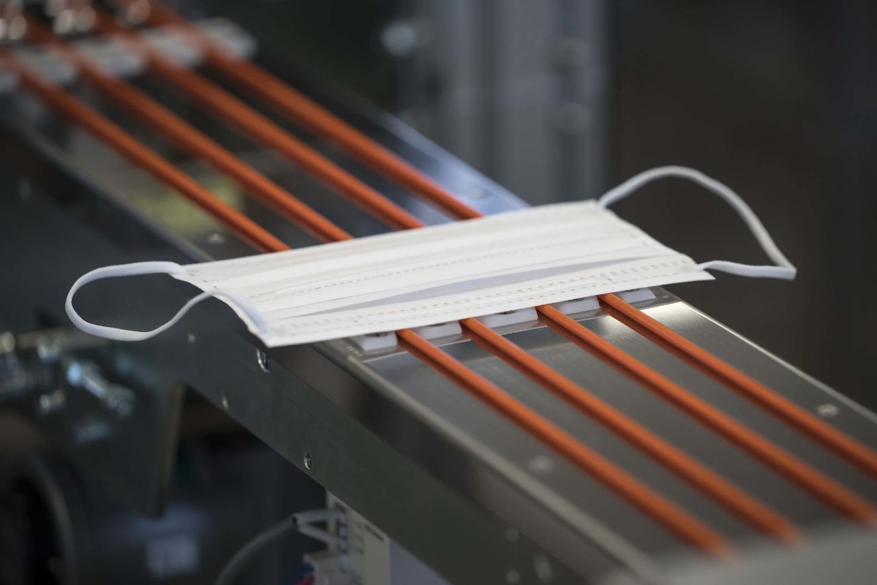 A disposable face mask moves on the production line at Yokoi Co. Ltd. factory in Nagoya, Japan on Thursday.