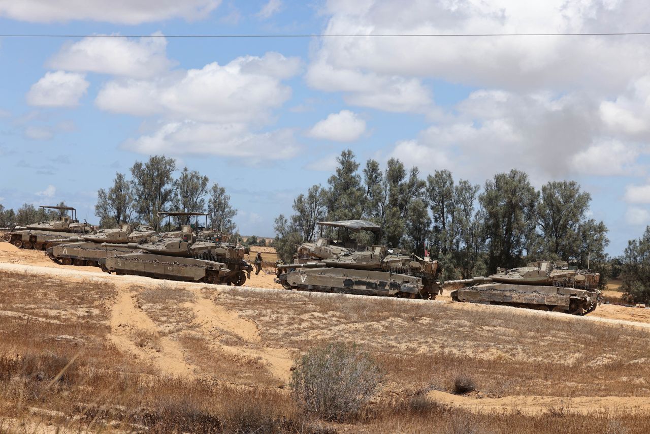 Israeli army tanks take position in southern Israel near the border with the Gaza on May 6. 